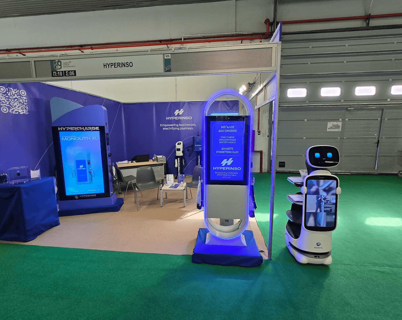 A panoramic view of the Hyperinso stand with Monolith XL chargers and the service robot
